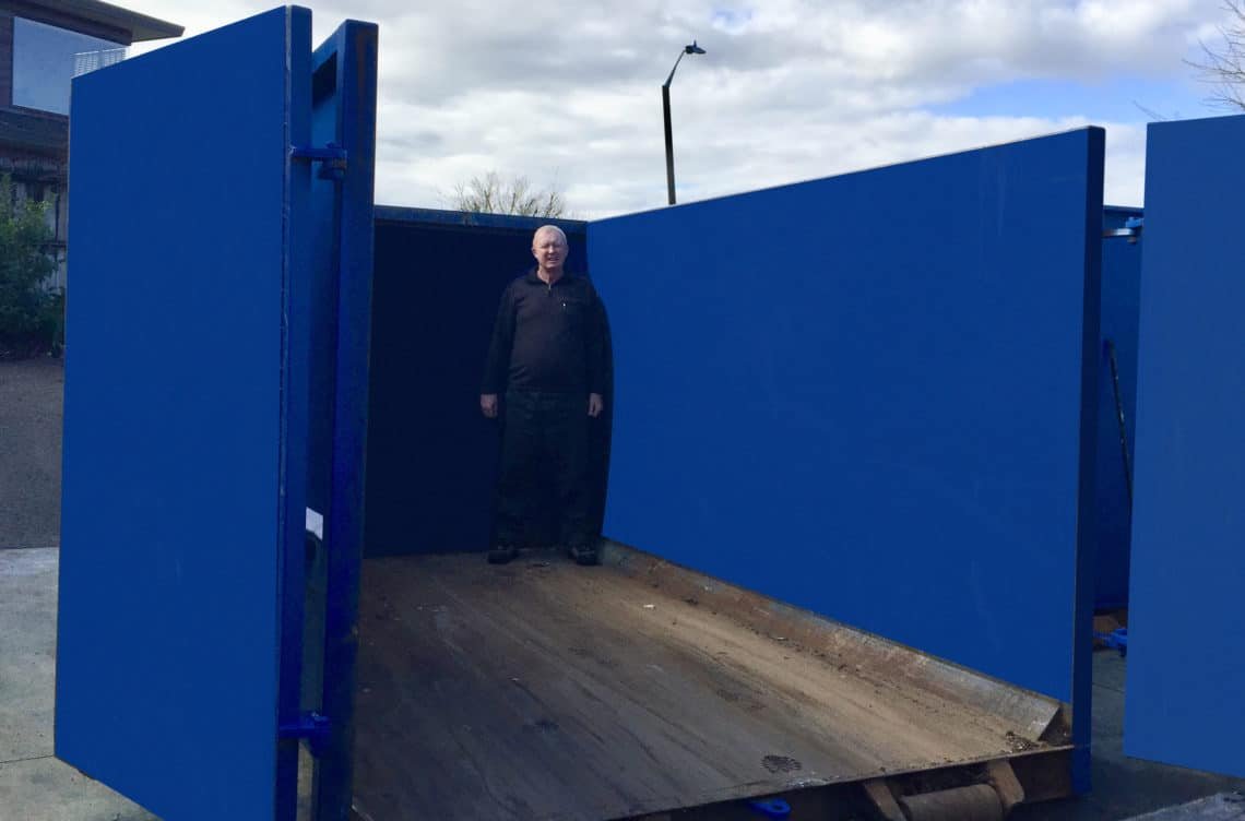 Man inside a  15 metre rubbish bin